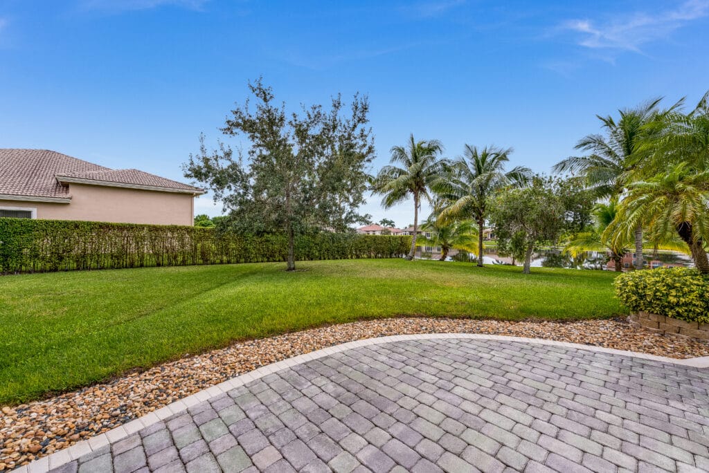 Cape Coral yard after storm clean up with cleared debris, trimmed branches, and restored lawn.