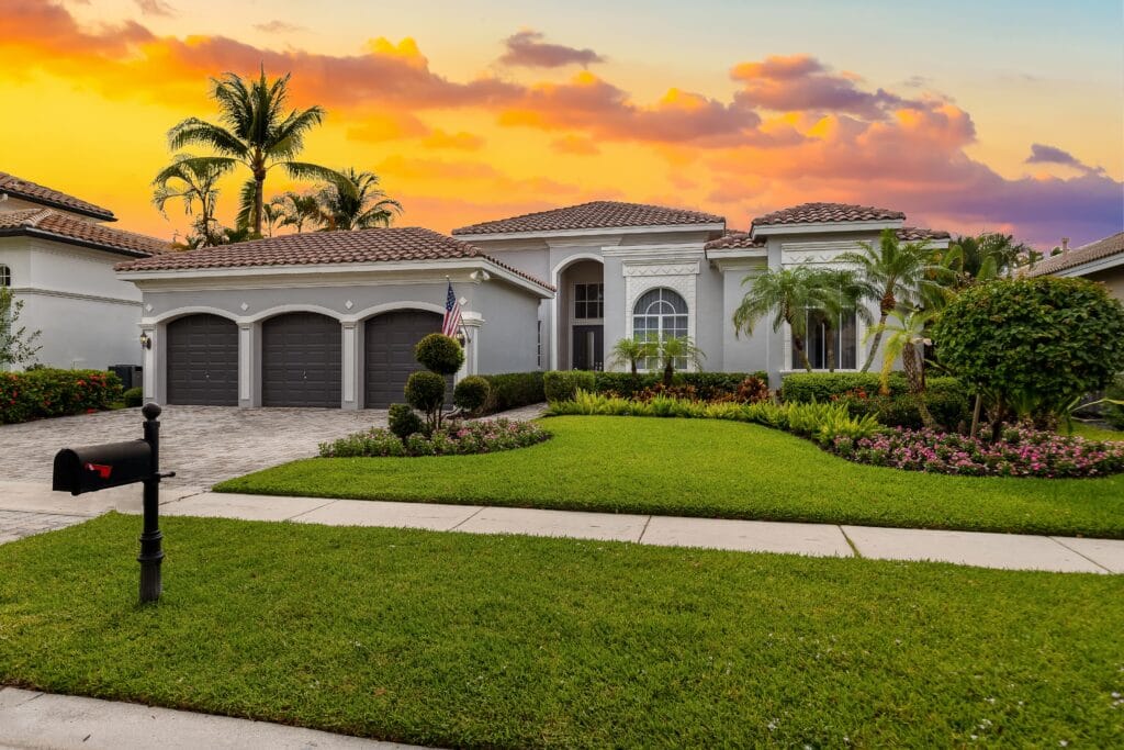 Complete property transformation in Cape Coral featuring a healthy lawn, updated landscaping, and upgraded home exterior.