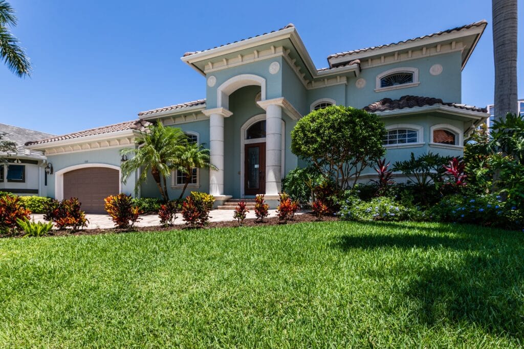 Florida-friendly landscaping with drought-tolerant plants and low maintenance lawn design in Cape Coral.