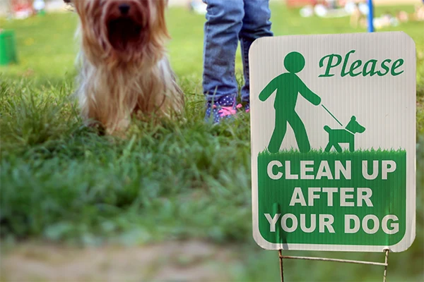 A large red home with a freshly cut lawn with the cross hatching design.