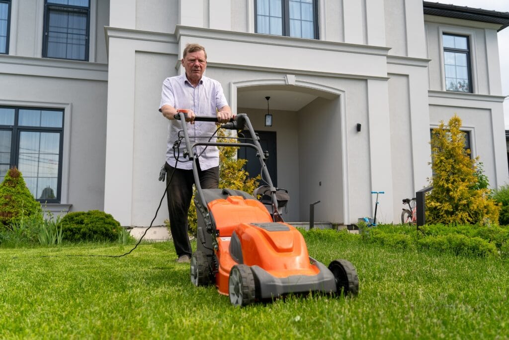 New Cape Coral homeowner mowing and caring for a healthy Florida lawn.