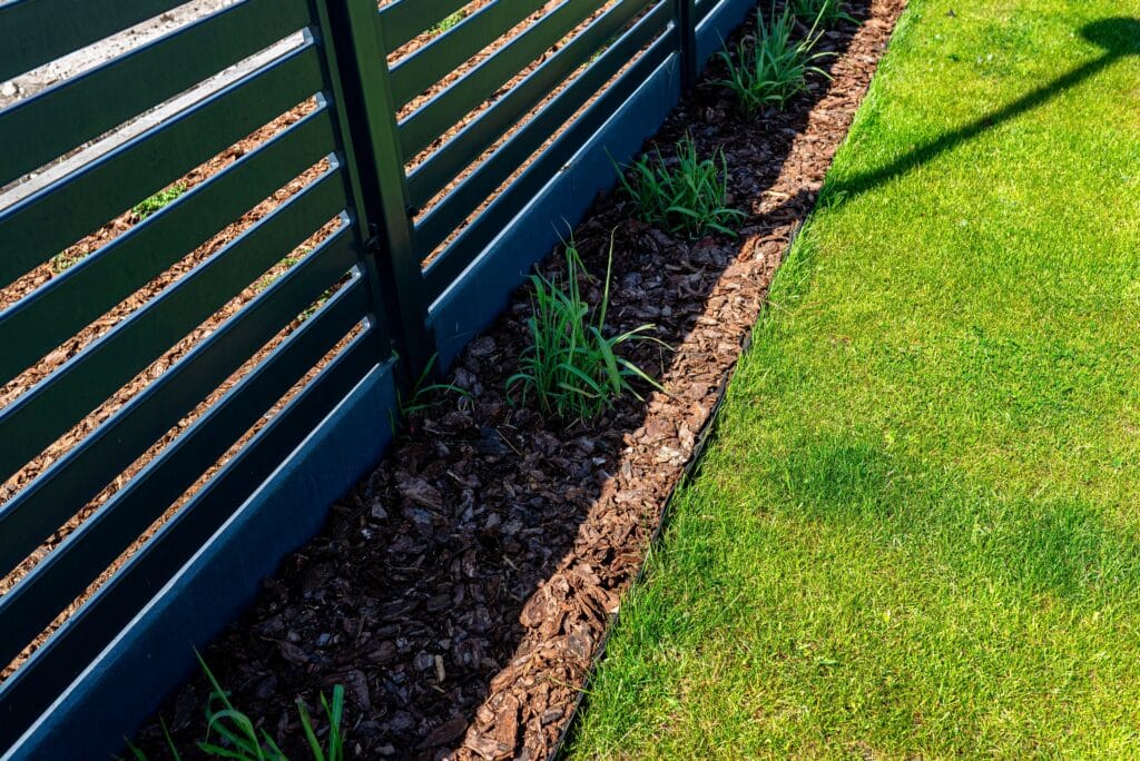 Cape Coral lawn with clean edging and fresh mulch creating a polished, well-maintained landscape.