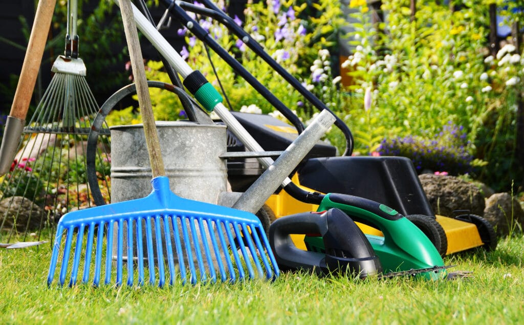 Several lawn care tools sitting in a Cape Coral Yard.