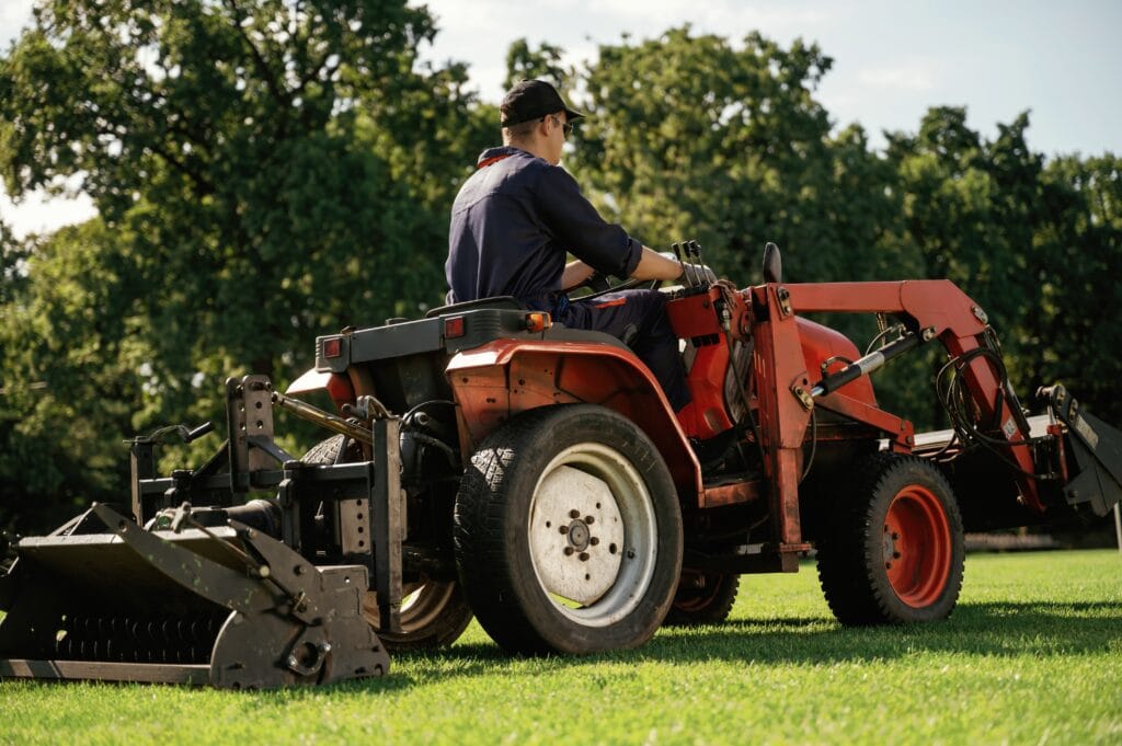 Lawn aeration service being performed on a Cape Coral lawn to improve soil health and grass growth.