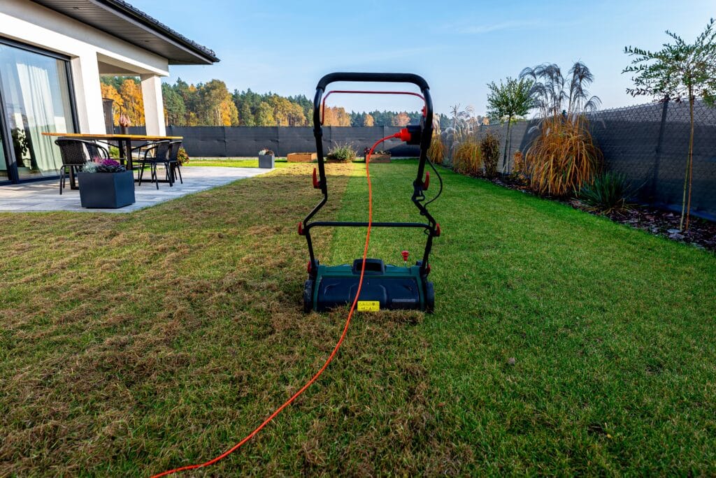 Compacted Florida lawn being aerated to improve drainage and root growth in Cape Coral.